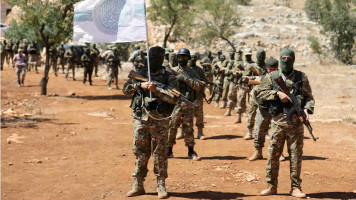 Fighters of jihadist Tahrir al-Sham group in Idlib province