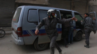 MVI_2075-white helmets carrying injured into truck.mp4.00_00_17_18.Still001.jpg