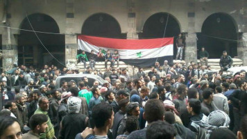 [Syrian regime flag raised in Douma [Twitter