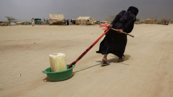 Yemen woman  water - Getty 