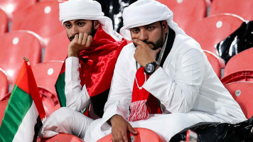 UAE fans dejected(Getty), Qatar fans celebrate (AFP