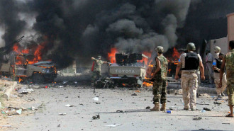 Pro-government forces after a blast in Libya