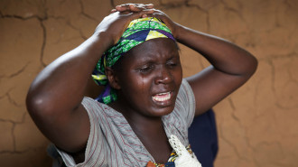 Congolese woman mourning [Getty]