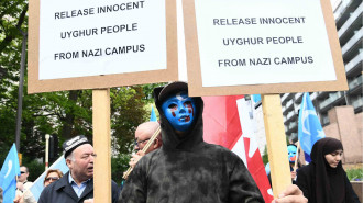 Ethnic Uighurs take part in a protest in Brussels