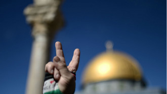 A Palestinian flashes a victory sign [Getty] 