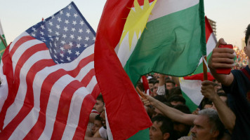 US and Kurdish flags ANADOLU