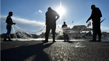 Lampedusa fishermen nets Getty.jpg