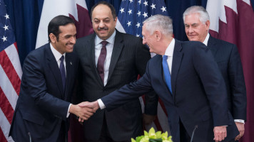 US defense secretary shakes hands with Qatari foreign minister