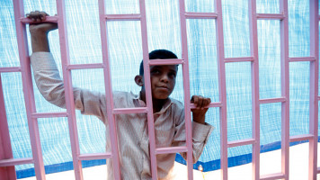 child behind bars