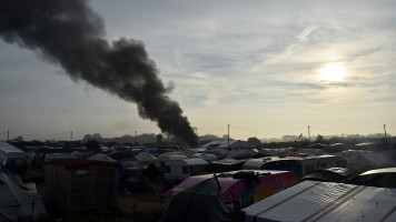 Calais camp flames