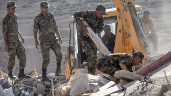 The Moroccan military looks through rubble following a deadly earthquake that hit the country