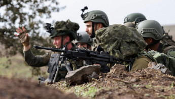 Members of the Israeli army's infantry 6th brigade take part in an assault coordination exercise near Moshav Kidmat Tsvi in the Israel-annexed Golan Heights