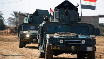 Two Iraqi army trucks