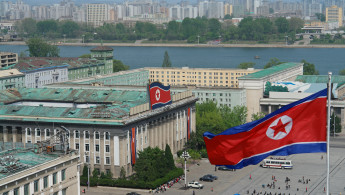 A North Korean flag is seen blowing in the air in Pyongyang