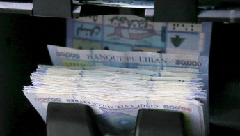 A counting machine counting 50,000 Lebanese pound banknotes