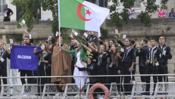 Members of the Algerian delegation threw roses into the Seine [Getty]