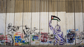 Israeli-built West Bank Wall surrounding Bethlehem with mural art, Bethlehem, West Bank, Israel