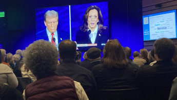 At a debate watch party, people gather for the Harris-Trump face-off. [Brooke Anderson/TNA]