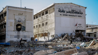 the heavily damaged building of Al-Azhar University in Gaza City, 