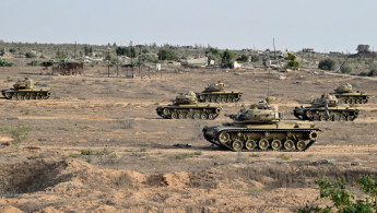 Egyptian army tanks are deployed along the border with the Gaza Strip on 4 July 2024 in al-Arish, in the north Sinai Peninsula, amid continuing battles between Hamas and Israel in Palestinian besieged territory. [Getty]