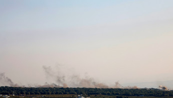 Smoke billows over hills in the Israeli-annexed Golan Heights after rockets were fired from southern Lebanon on August 6, 2024. A Lebanese security source said six Hezbollah fighters were killed in Israeli strikes on August 6.