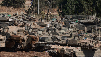 	Israeli army tanks are deployed in the Upper Galilee region of northern Israel near the border with Lebanon on September 29, 2024. 