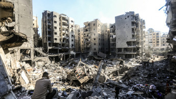 People check the rubble of buildings which were levelled on September 27 by Israeli strikes that targeted and killed Hezbollah leader Hassan Nasrallah in the Haret Hreik neighbourhood of Beirut's southern suburbs, on September 29, 2024. (AFP/Getty)