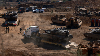 Israeli tanks massing on the border with Lebanon