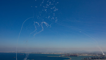 The Israeli military fires Iron Dome missiles to intercept dozens of rockets launched from Lebanon at the northern port city of Haifa, in Israel, on October 8, 2024. (Photo by Mati Milstein/NurPhoto via Getty Images)