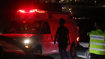 An ambulance leaves the scene of a drone strike near the northern Israeli town of Binyamina, on October 13, 2024.