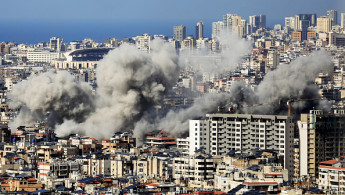 Smoke rises from the site of an Israeli airstrike that targeted a neighbourhood in Beirut's southern suburbs on November 12, 2024. (Photo by AFP via Getty Images)