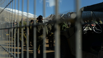  Israeli soldiers prepare to enter the UN-patrolled buffer zone on the Golan Heights Golan Heights on January 01, 2025 in Majdal Shams, in the Israeli-occupied Golan Heights. 