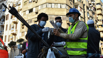 Facemasks in Egypt [Getty]