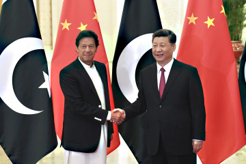 China's President Xi Jinping, right, shakes hands with Pakistan's Prime Minister Imran Khan before a meeting at the Great Hall of the People on 28 April 2019 in Beijing, China. [Getty]