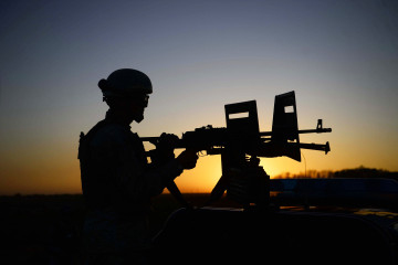 An Afghan National Security Forces soldier mans a machinegun mounted on a vehicle while patrolling an area during a military operation in Herat province. [Getty]