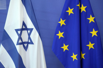 An Israeli flag is set next to a European Union flag at the European Union Commission headquarters in Brussels in 2016. [Getty]