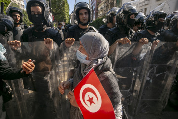 Demonstrators gather at Avenue Habib Bourguiba to protest against Tunisian President Kais Saied's "extraordinary decisions" amid a heavy security presence in Tunis, Tunisia on October 10, 2021