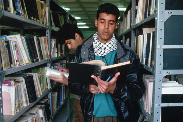 Students Reading in the Stacks of a Library (Photo by Peter Turnley/Corbis/VCG via Getty Images)