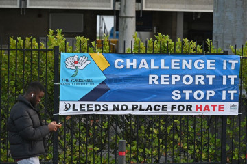 An anti-racism banner hangs on railings outside Headingley, the home of Yorkshire cricket on November 5, 2021