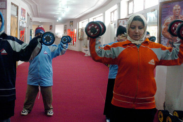 Afghan women exercise at a the Salar Afghaqn Gym in Herat, 11 January 2006 [Getty Images]