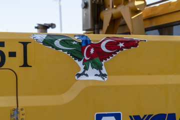 A sticker celebrating the friendship between Azerbaijan, Turkey and Pakistan seen on a truck in Baku