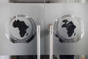 The logo of the African Union (AU) is seen at the entrance of the AU headquarters on March 13, 2019, in Addis Ababa