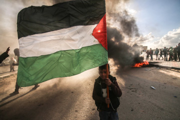 A boy seen holding a Palestinian flag, during the demonstration. Palestinians seen protesting in Rafah, in the southern Gaza Strip against Israel's confiscation of Palestinian lands and its razing in the Negev desert in southern Palestine. 