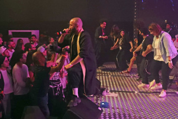 Iraqi-Canadian hip-hop artist Yassin Alsalman, known by his stage name Narcy, performs the chobi, an Iraqi folk dance, to his Arabic and hip-hop beats on stage at the Dubai International Marine Club during a music festival in the United Arab Emirates