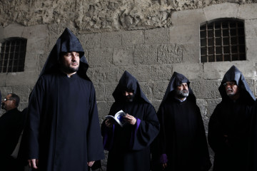 Armenian clergymen attend the funeral procession of the 96th Armenian Patriarch of Jerusalem Torkom Manougian II at St. James Cathedral in Jerusalem's old city on October 22, 2012. Manougian, who passed away on October 12 at the age of 93, was buried in a funeral attended by representatives of all the Christian Churches of the Holy Land. AFP PHOTO/GALI TIBBON (Photo credit should read GALI TIBBON/AFP via Getty Images)