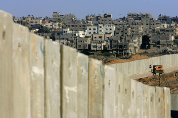 An Egyptian border post overlooks Israel's protective barrier and the Palestinian town of Rafah September 11, 2005