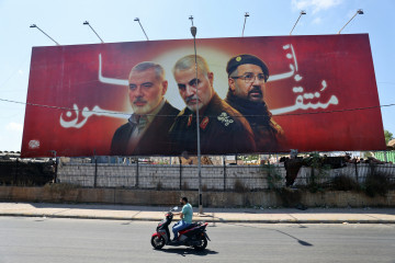 A billboard bearing portraits of Haniyeh, Soleimani, Shukr