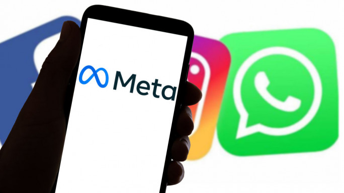 Logo of Meta in front of Facebook, Instagram and WhatsApp logos