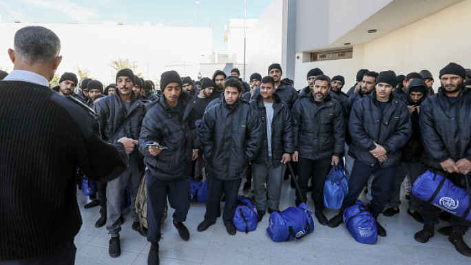 llegal migrants from Egypt wait during a deportation operation in the Libyan capital Tripoli on January 31, 2024. The body responsible for fighting against illegal immigration in Libya, in coordination with the International Organisation for Migration (IOM), organised the return of 350 illegal Egyptians to their country. 