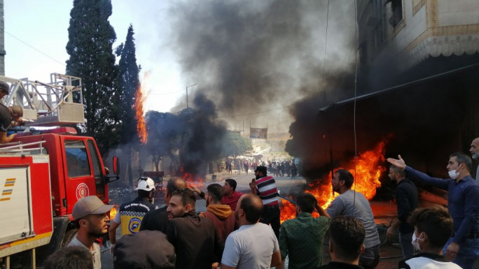 One of the explosions caused a fire at a market in central Jarabulus [Anadolu / Getty]